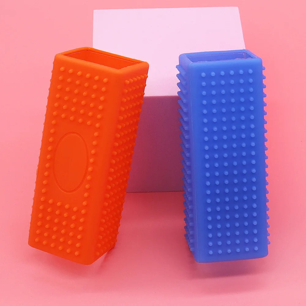 Orange and blue textured rectangular objects on a pink background