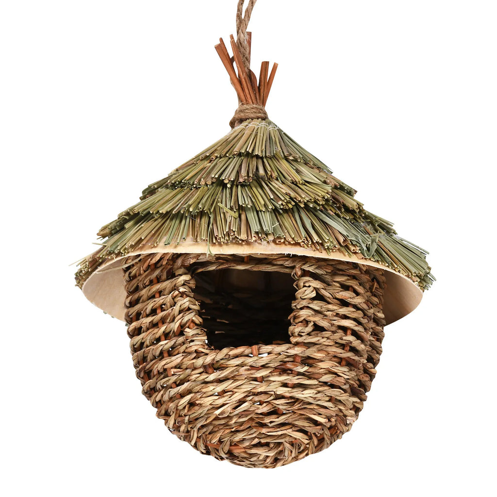 Woven birdhouse with a thatched roof on a white background